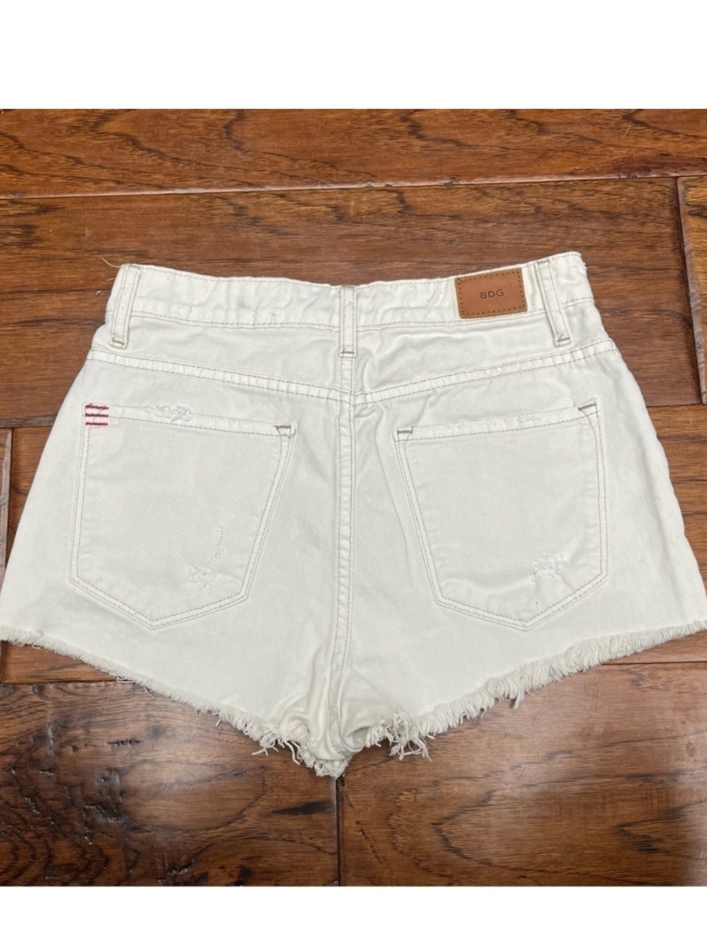 BDG 29 Super High-Rise Distressed Cream Denim Shorts Cheeky UO urban outfitters